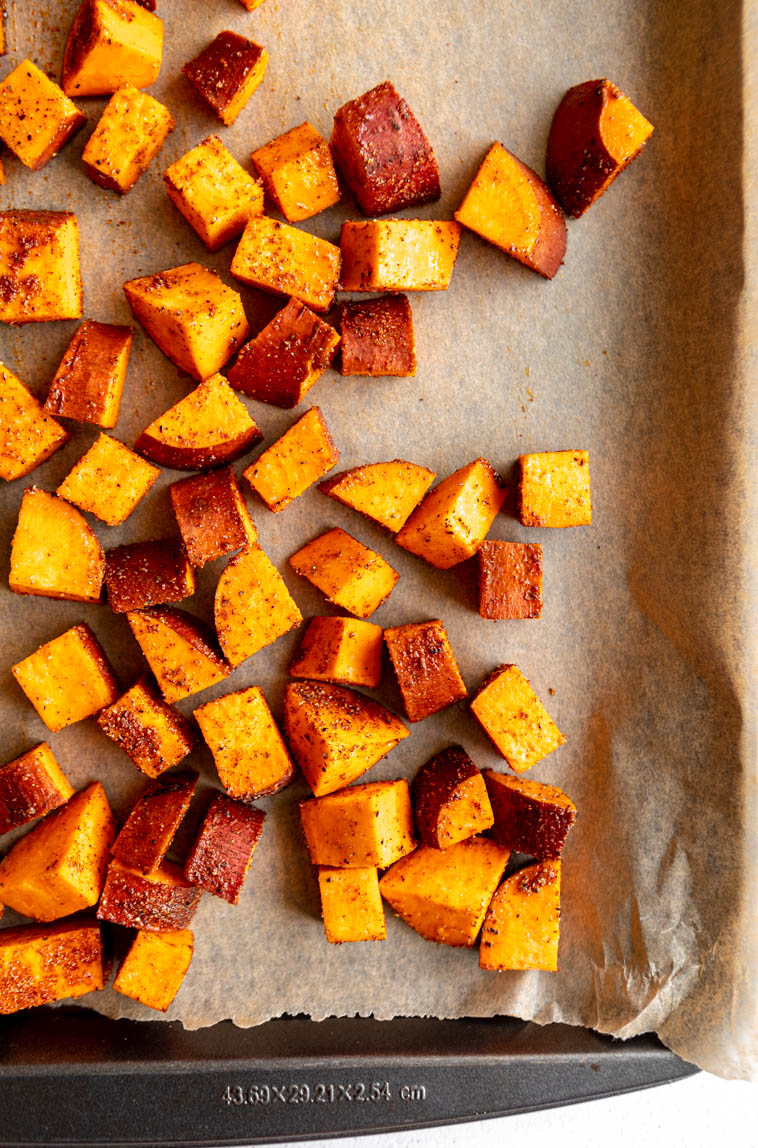 Sweet potatoes on a baking sheet.