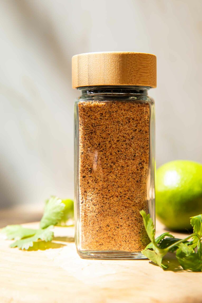 Close up of Taco Seasoning Recipe with limes and cilantro.
