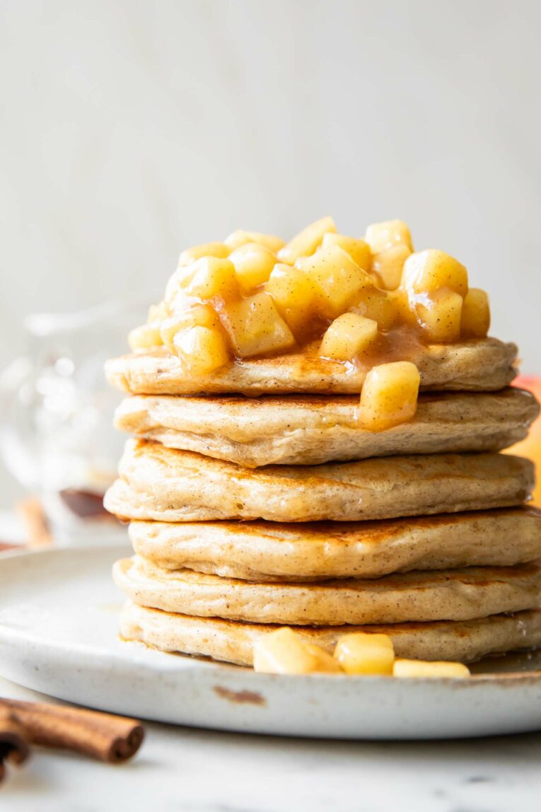 Close up of cottage cheese pancakes with apple topping.