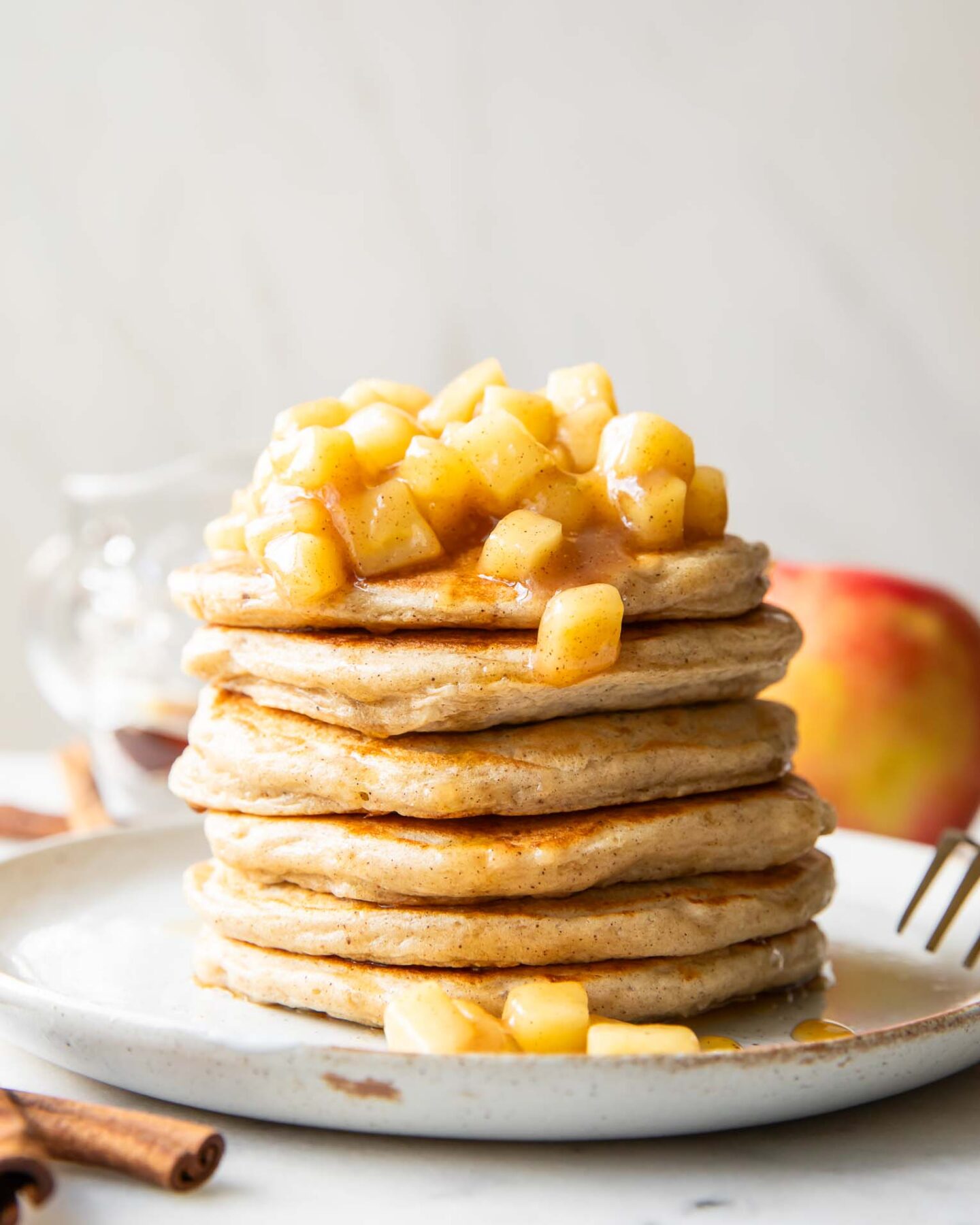 Apple Pie Protein Pancakes recipe stack of pancakes on a plate.