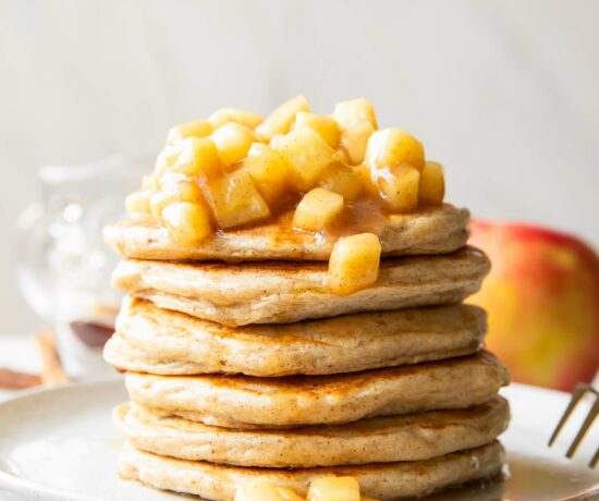 Apple Pie Protein Pancakes recipe stack of pancakes on a plate.