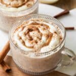 Cinnamon Roll Overnight Oats recipe in a mug jar with icing.