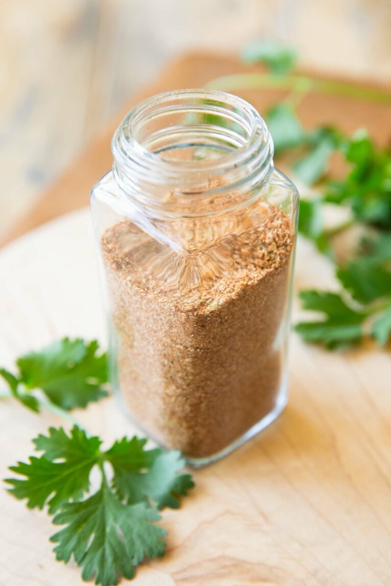 Angled photo of fajita seasoning in a spice jar.