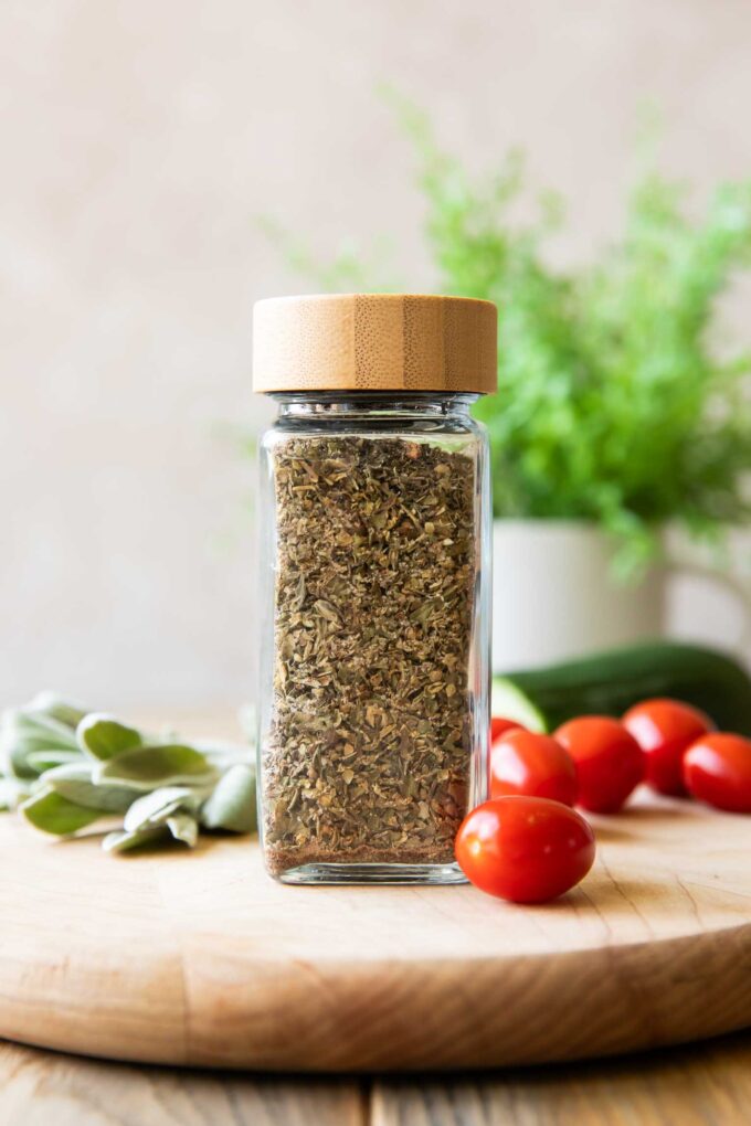 Close up of Greek Seasoning with tomatoes and sage.