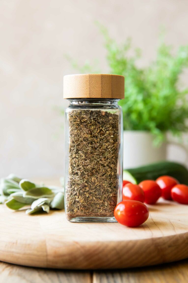 Close up of Greek Seasoning with tomatoes and sage.