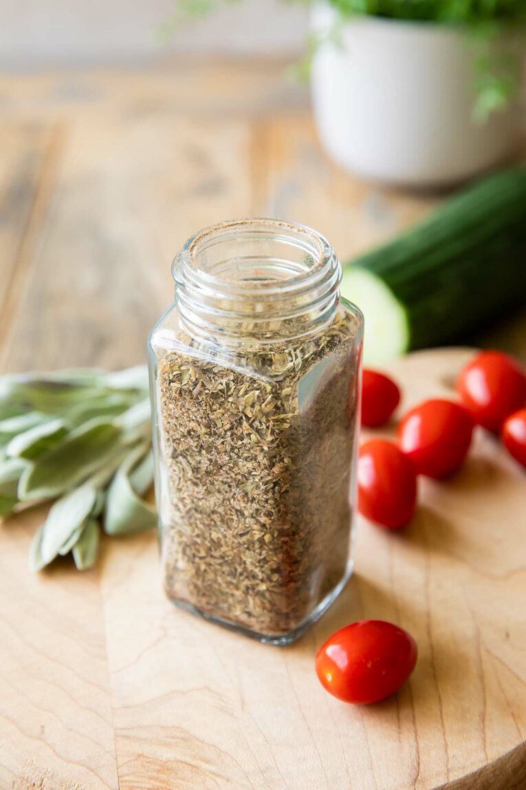 Homemade Greek Seasoning in a spice jar.
