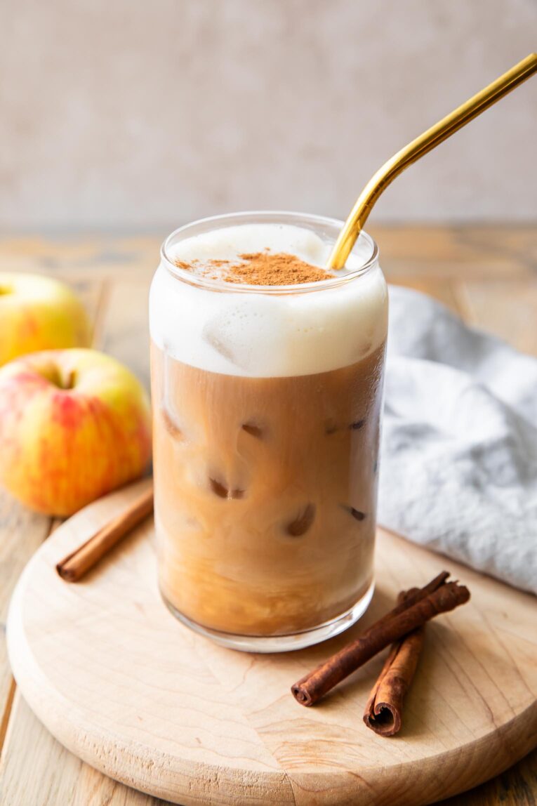 Angled photo of Iced Apple Crisp Cream Chai with apple crisp cold foam recipe.