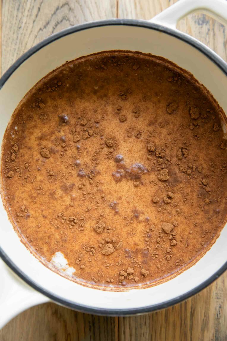 Top shot of ingredients for Pumpkin Spice Creamer in a saucepan.