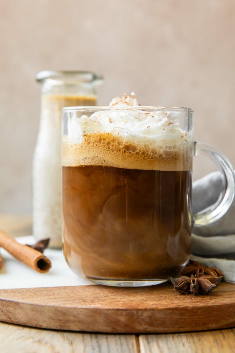 Close up of mug of coffee with Pumpkin Spice Creamer and whipped cream.
