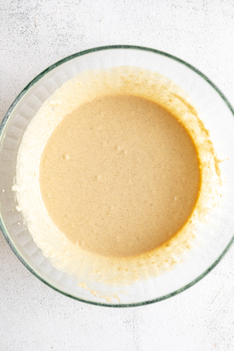 Vegetarian Waffle batter being mixed in a large bowl.