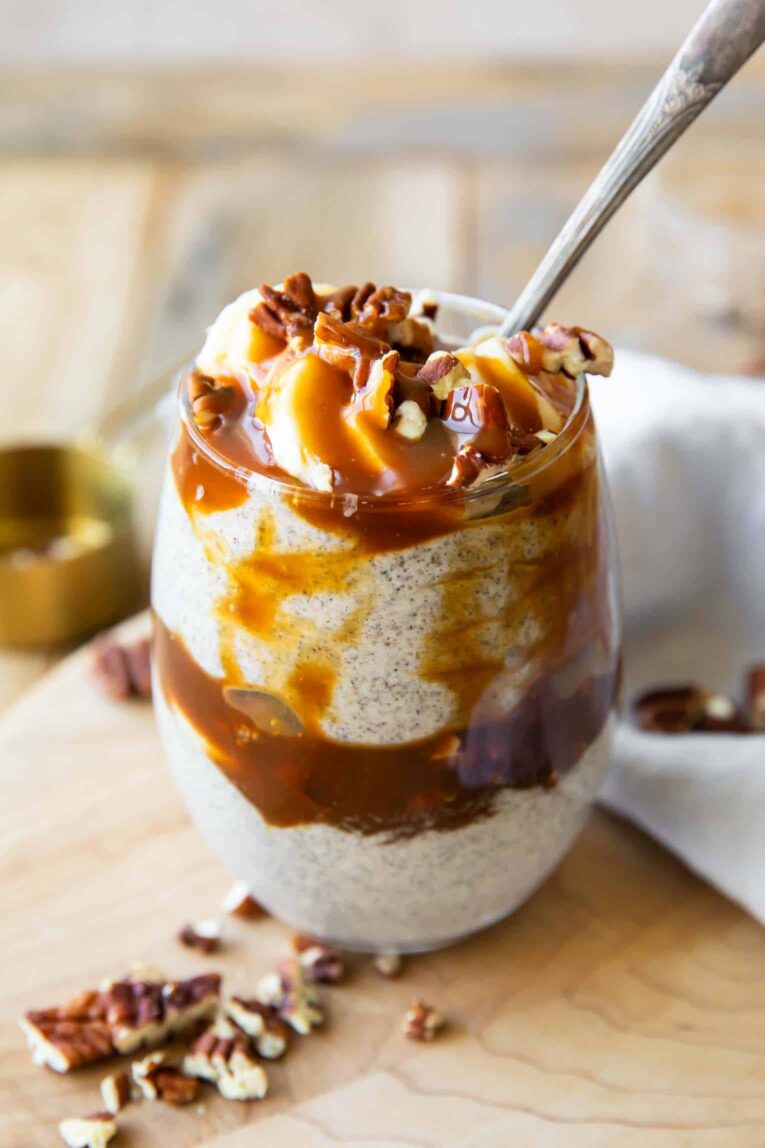 Angled photo of Dulce De Leche Chia Seed Parfait with pecans and bananas.