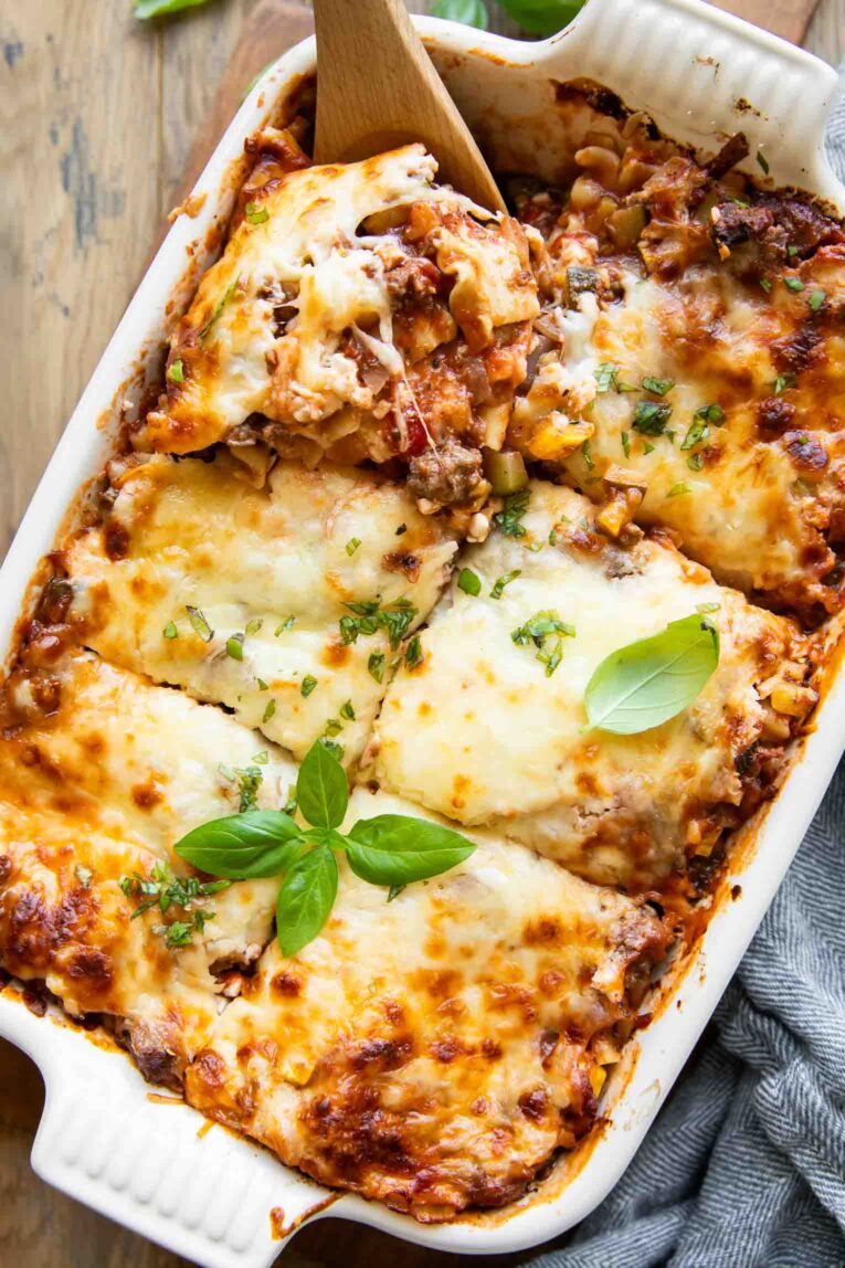 Sliced healthy cottage cheese lasagna in a casserole dish.