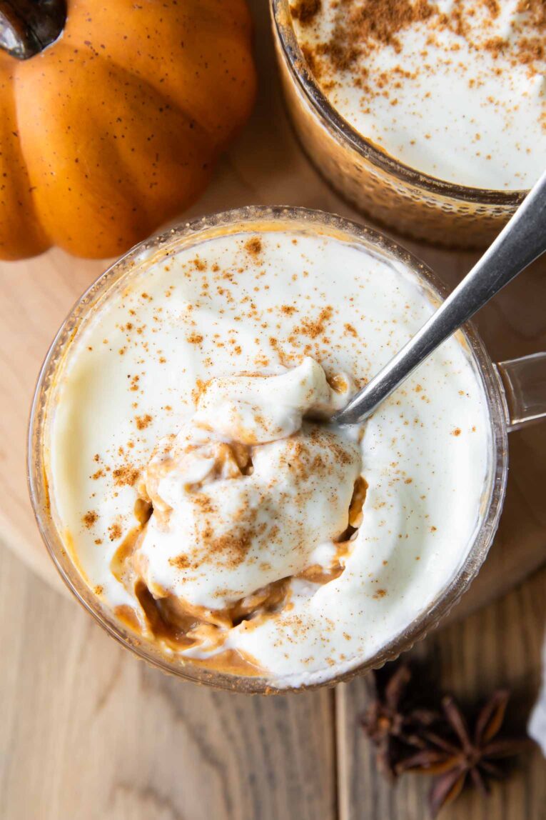 Top shot of Pumpkin Pie Overnight Oats with white chocolate yogurt topping.
