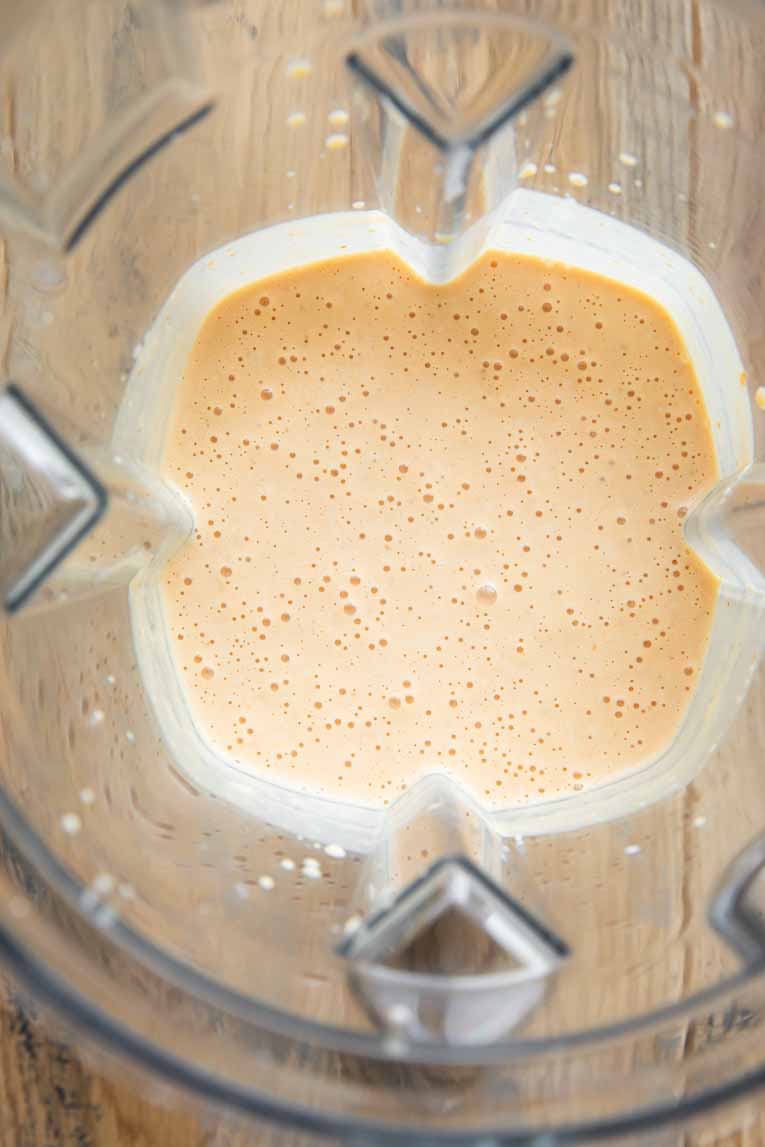 Ingredients for Pumpkin Protein Pancakes in a blender.