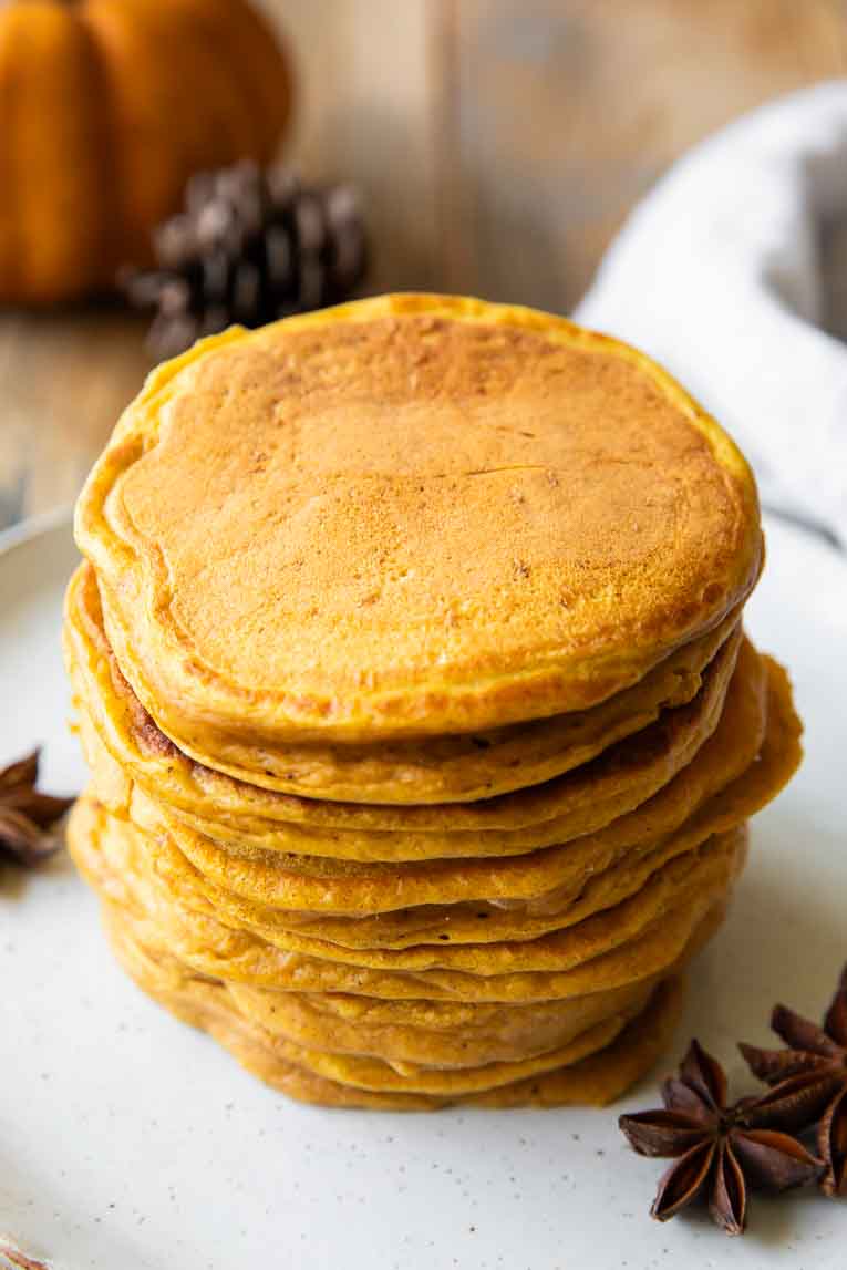 Angled photo of Pumpkin cottage cheese Pancakes stack.
