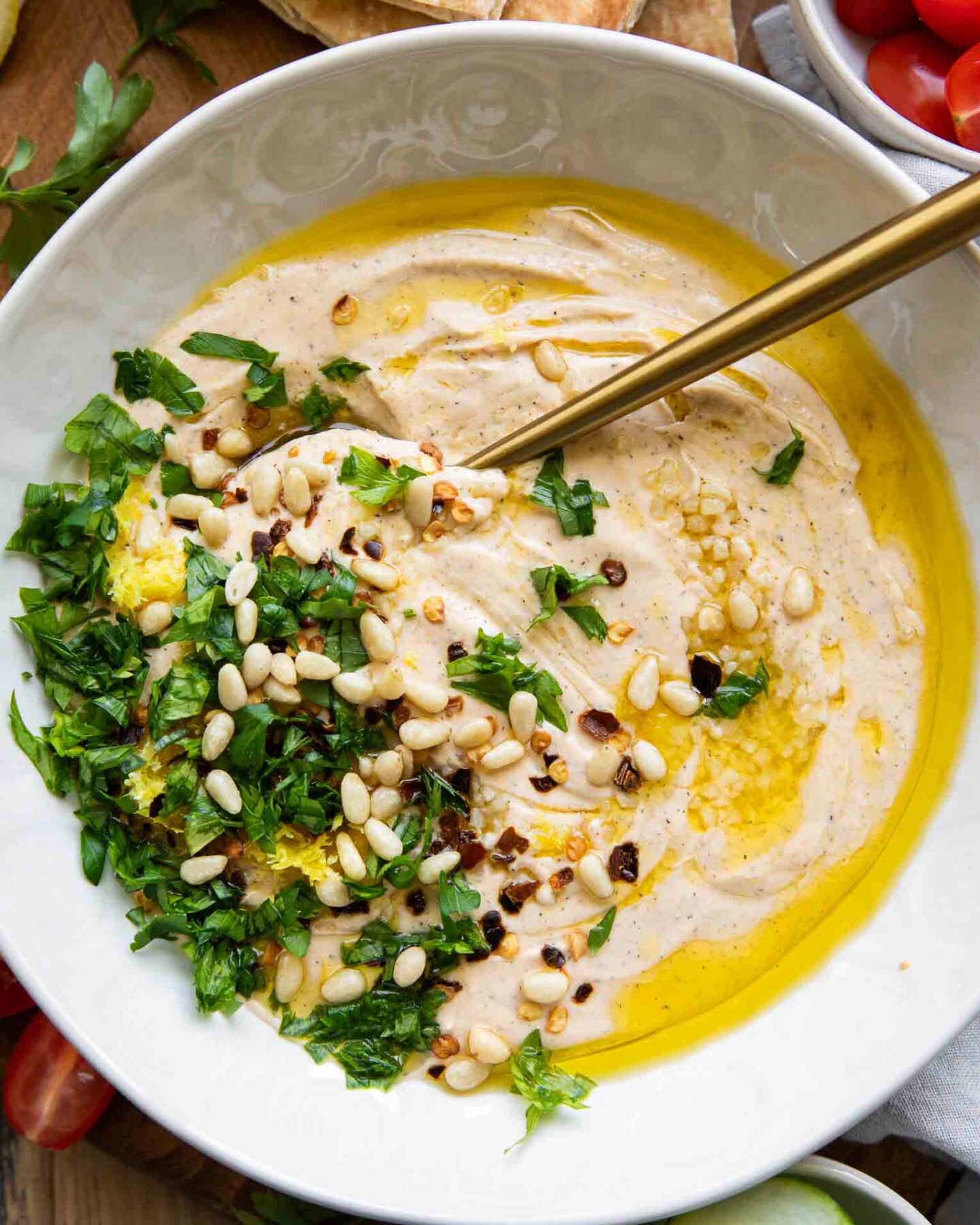 Whipped Feta Dip with pita bread and a spoon.