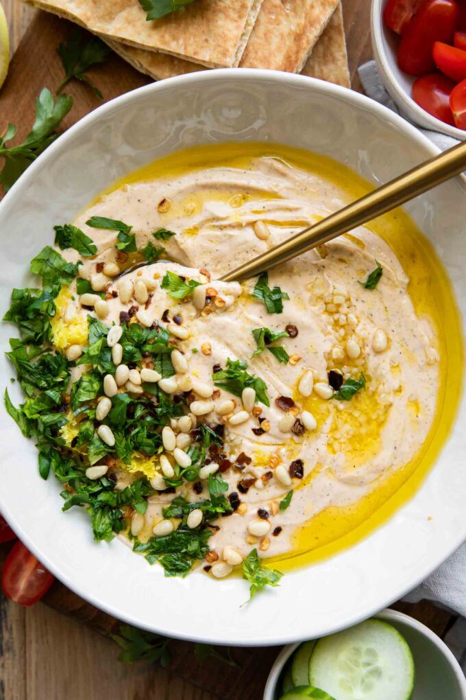 Whipped Feta Dip with pita bread and a spoon.