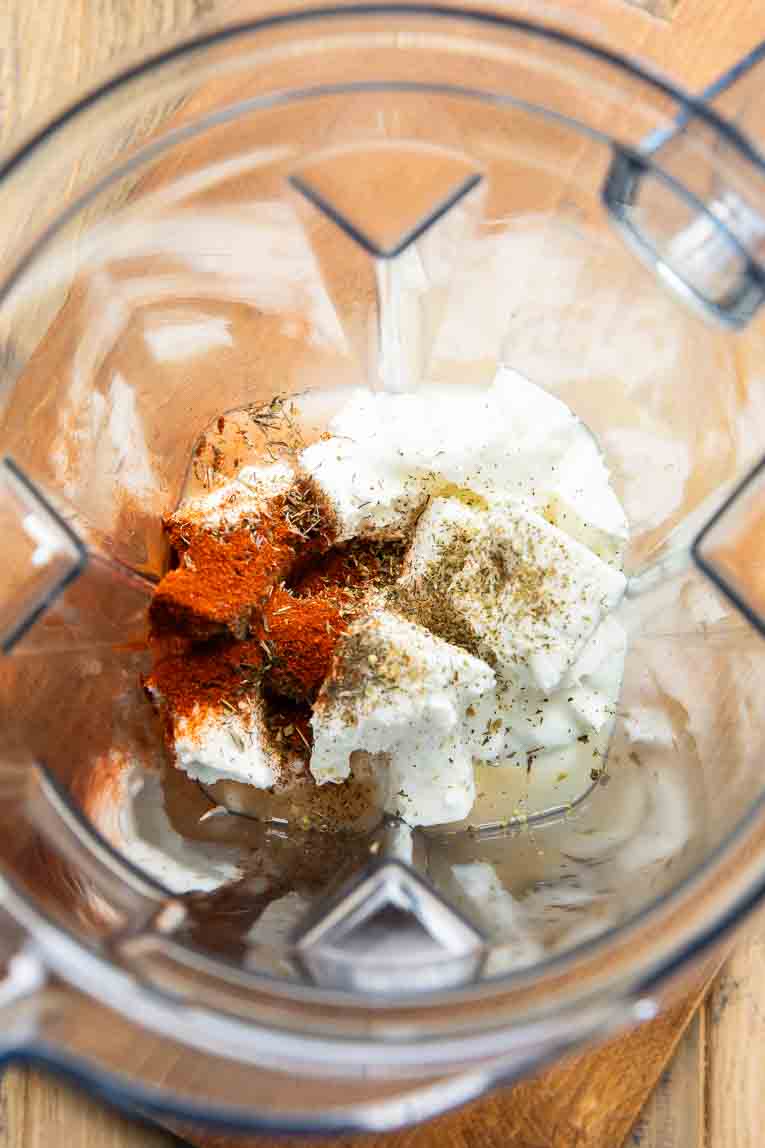 Ingredients for Whipped Feta Dip in a blender.