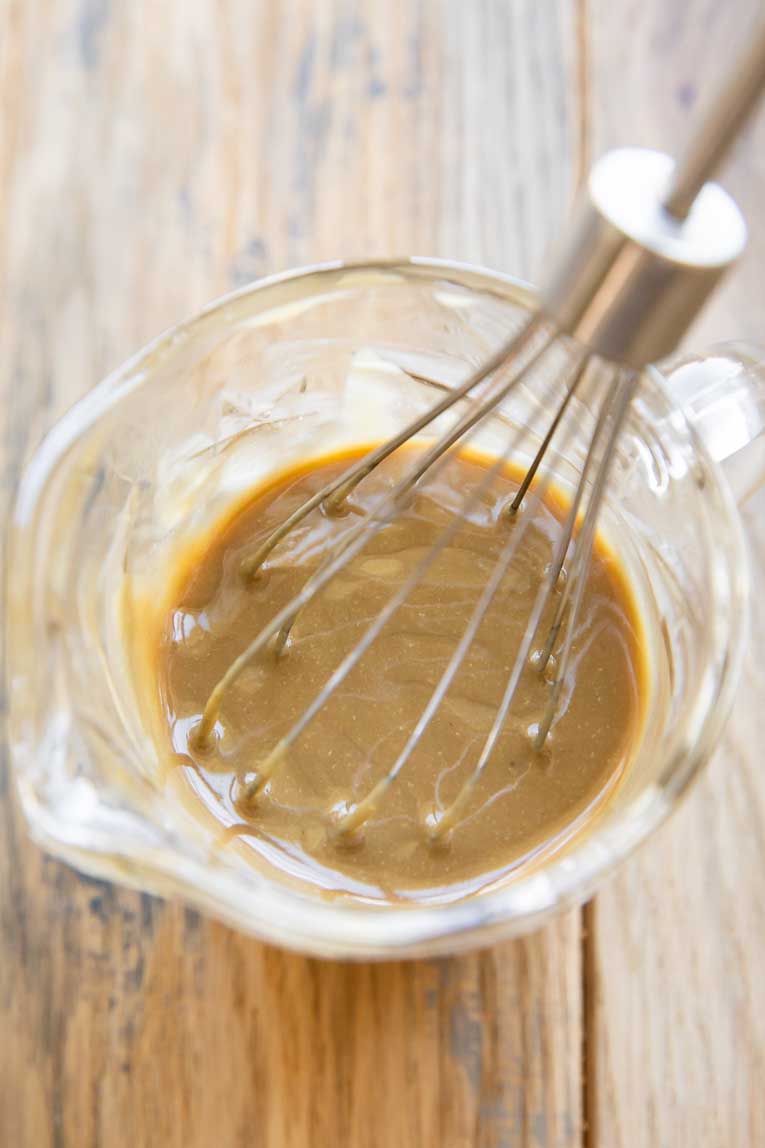 Balsamic Tahini dressing being whisked.