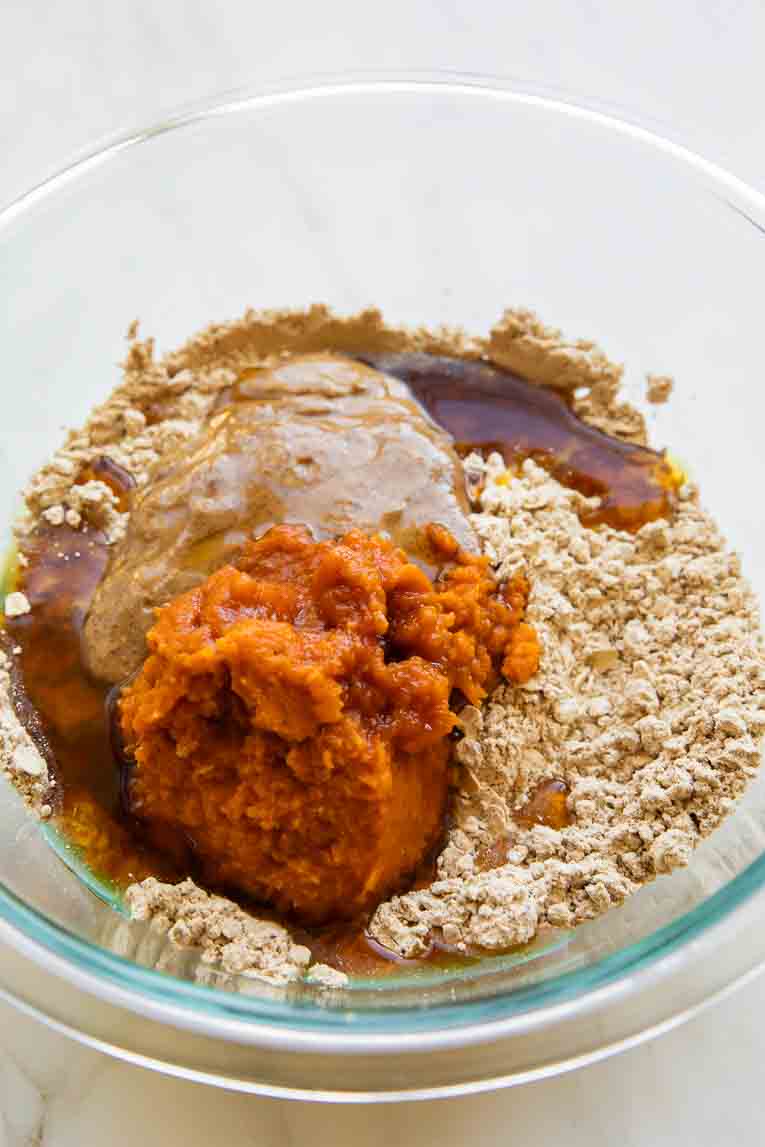 Ingredients for Pumpkin Protein Bars in a mixing bowl.