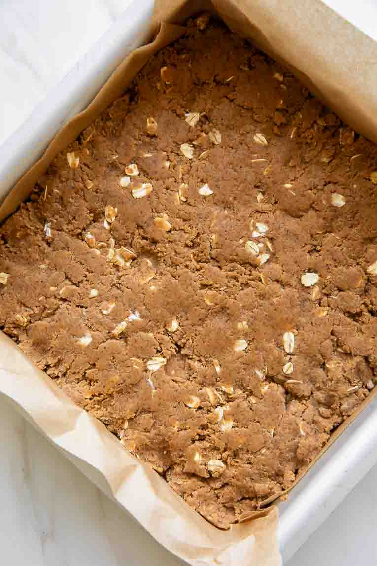 Pumpkin Protein Bars dough pressed into a baking pan.