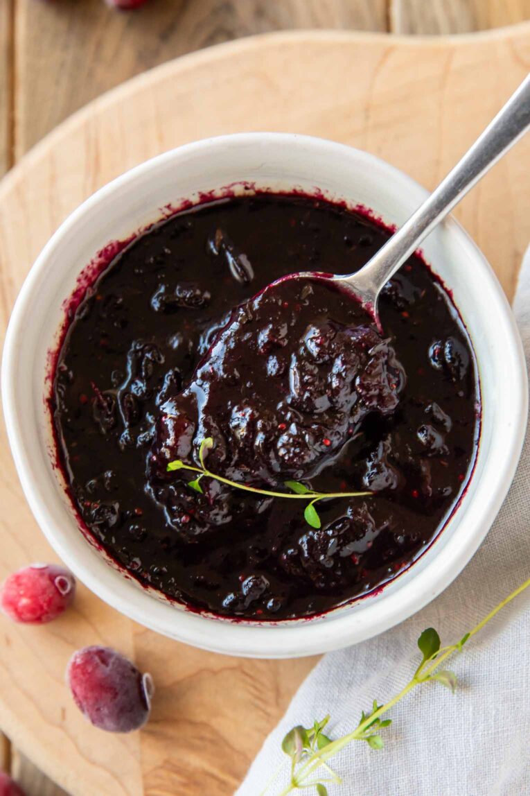 Close up of easy Cranberry Sauce Recipe with a spoon.
