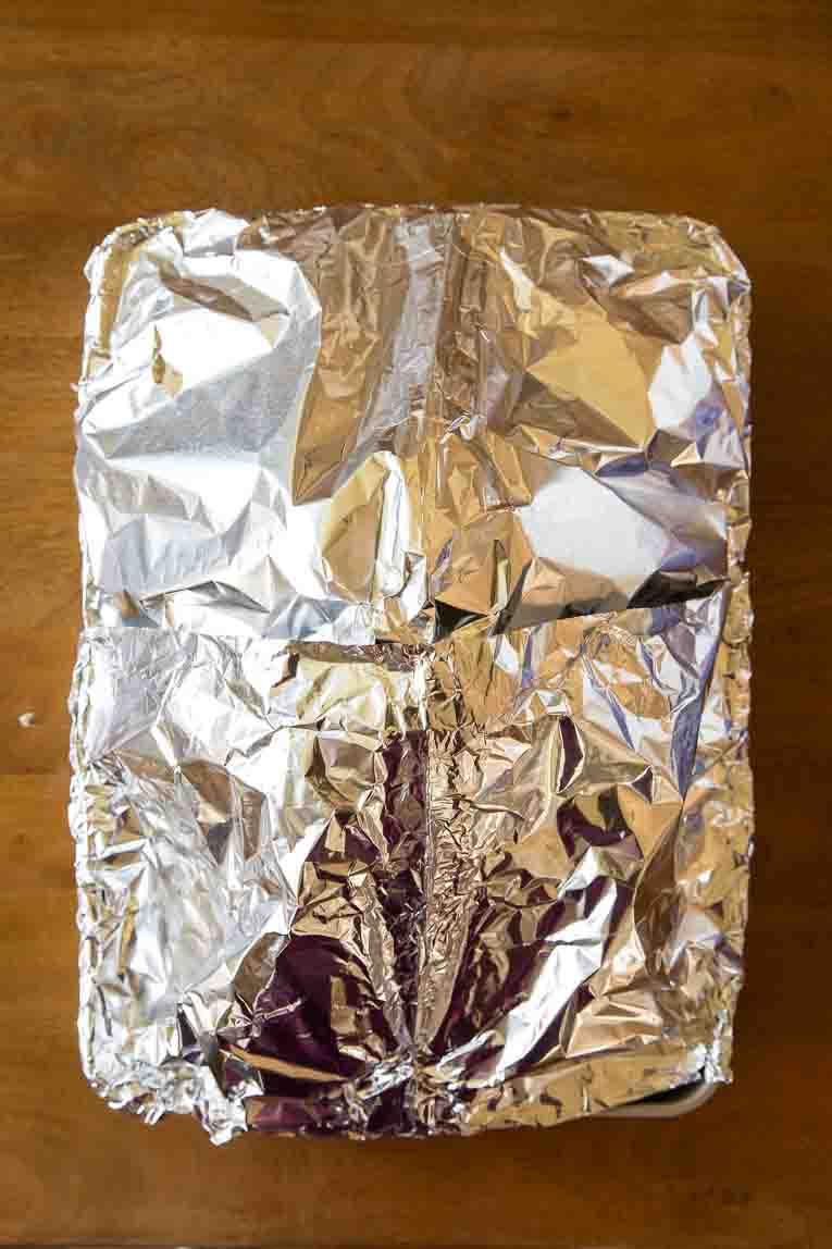 Foil paper tent covering entire Thanksgiving turkey.