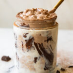 Mocha Overnight Oats with a spoon.