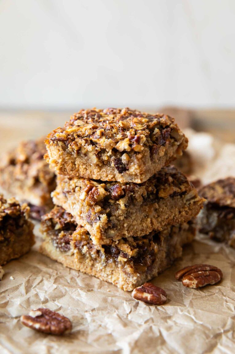 3 Pecan Pie Bars stacked on each other.