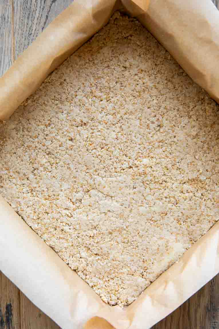 Pecan Pie Bar crust pressed into a pan.