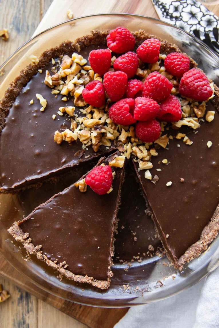 Close up of Raspberry Chocolate Hazelnut Pie with slices taken out.