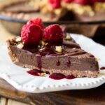 Across slice of Raspberry Chocolate Hazelnut Pie with topping.
