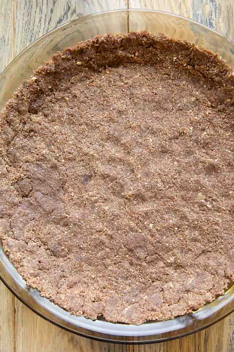 Chocolate pie crust pressed into a pie pan.