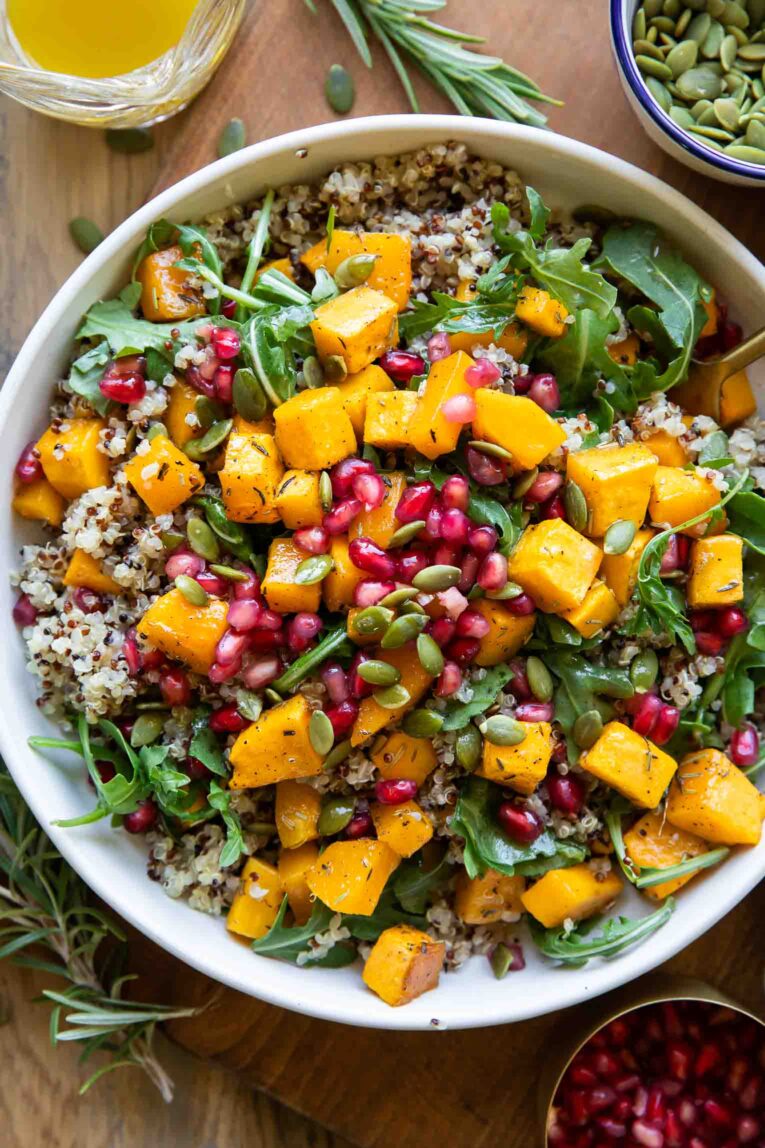 The best Roasted Butternut Squash Quinoa Salad recipe in a bowl with a fork.