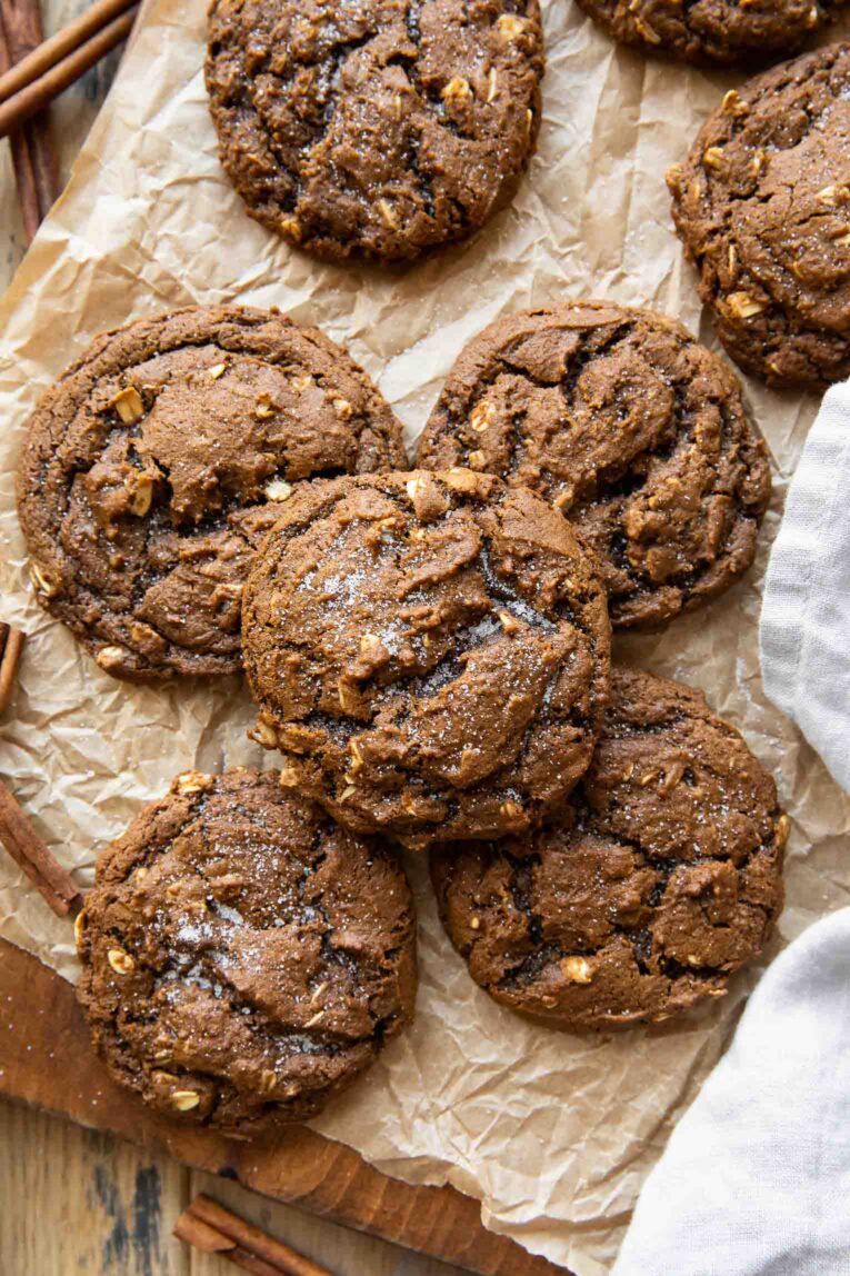 Spiced Oatmeal Molasses Cookies on parchment paper.