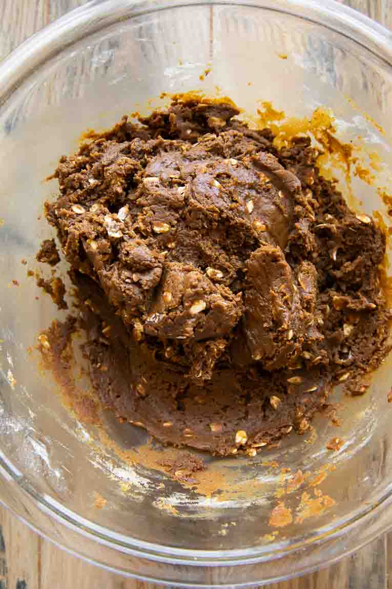 Spiced Oatmeal Molasses Cookie dough in a mixing bowl.