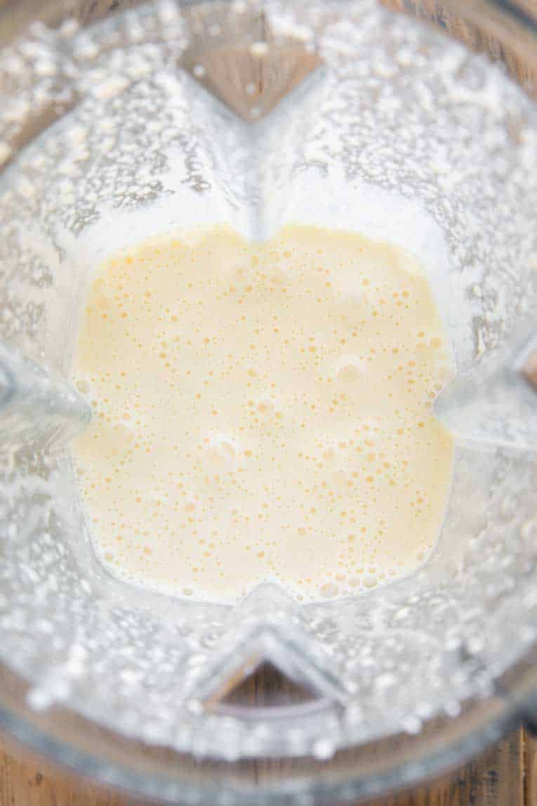 Cottage cheese, milk, and eggs in a blender.