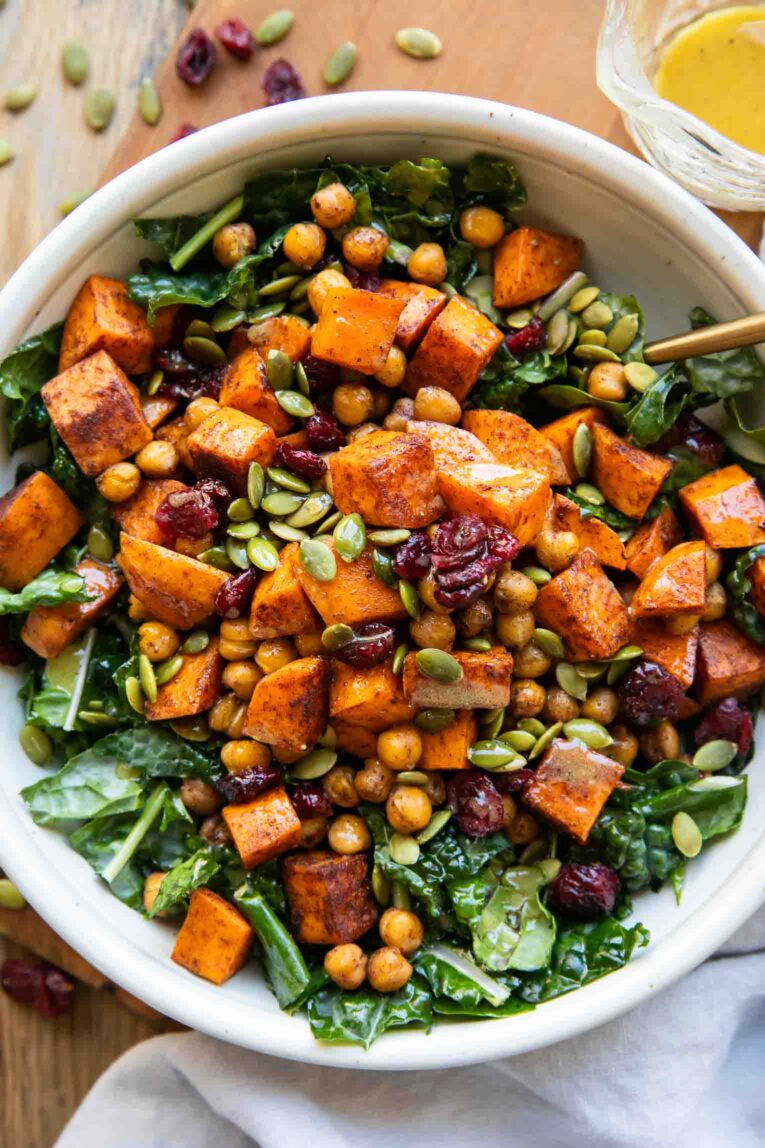 Winter Spiced Chickpea Power Bowl with a fork and dressing.
