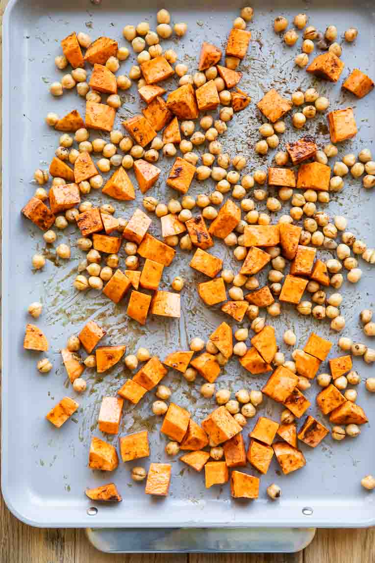 Sweet potatoes and chickpeas on a sheet pan.