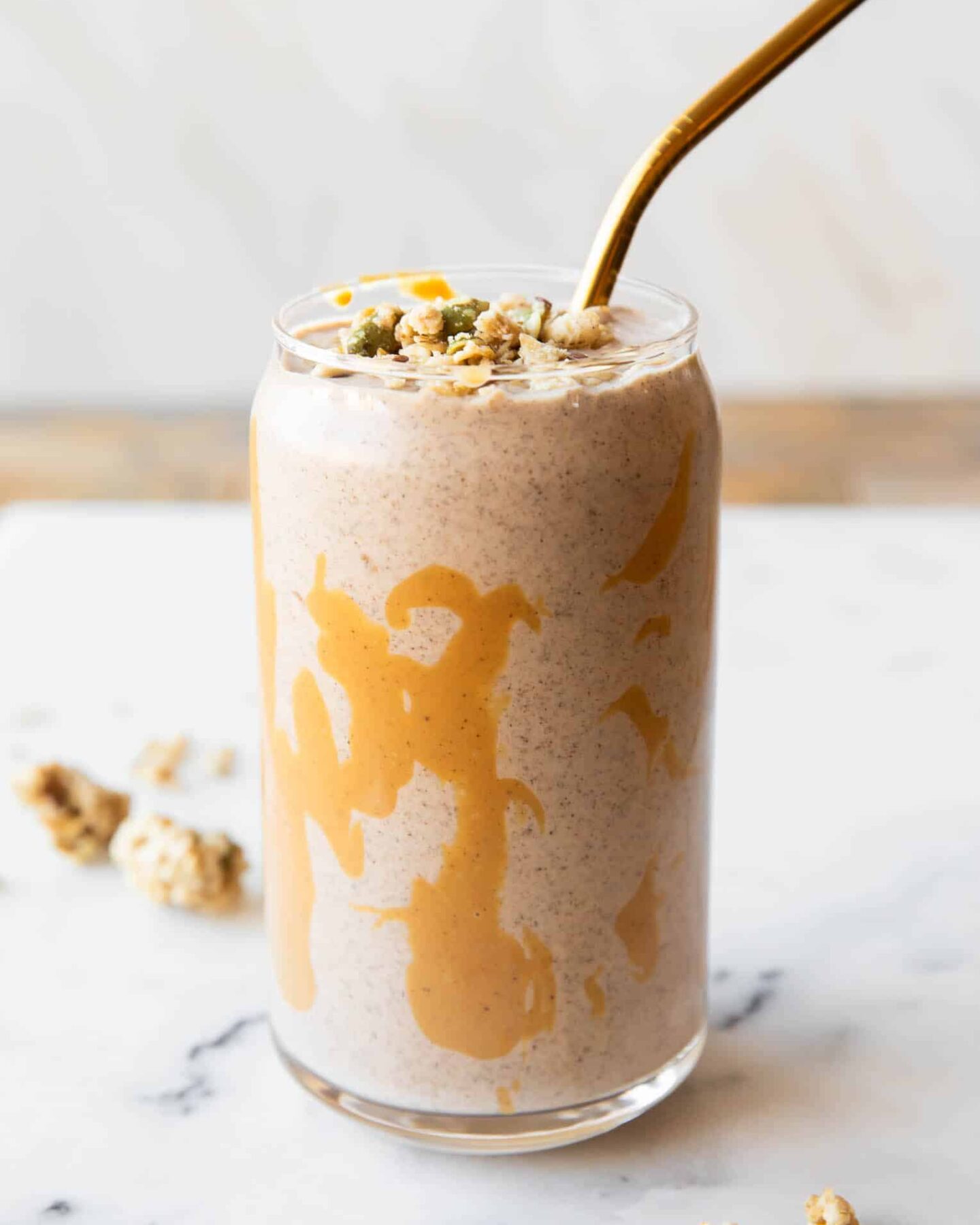 Banana cashew smoothie in a glass with chia seeds.