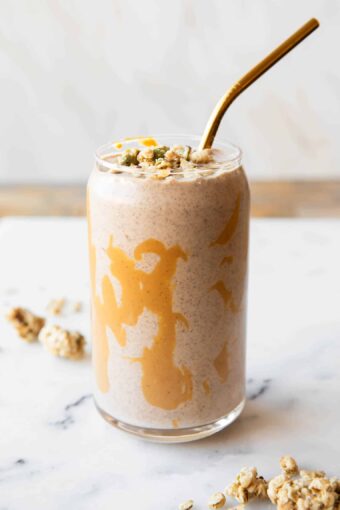 Banana cashew smoothie in a glass with chia seeds.