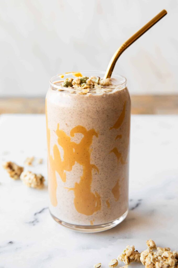 Banana cashew smoothie in a glass with chia seeds.