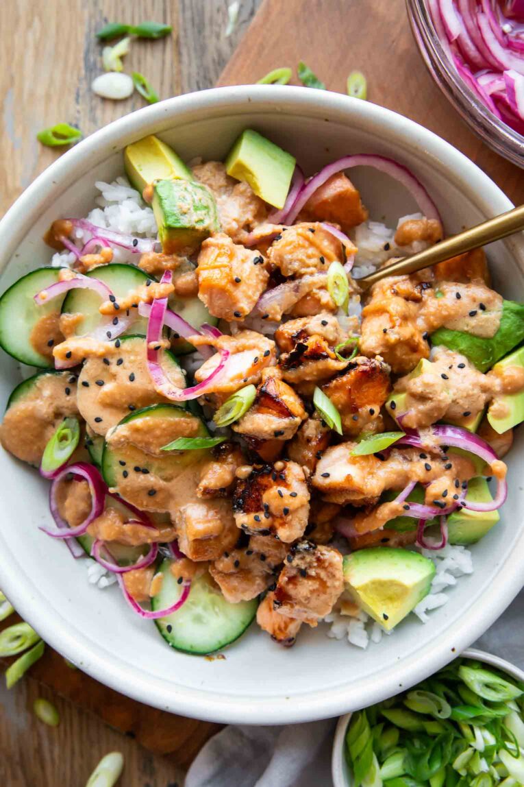 Top shot of Miso Glazed Salmon Bowl on a wood table.