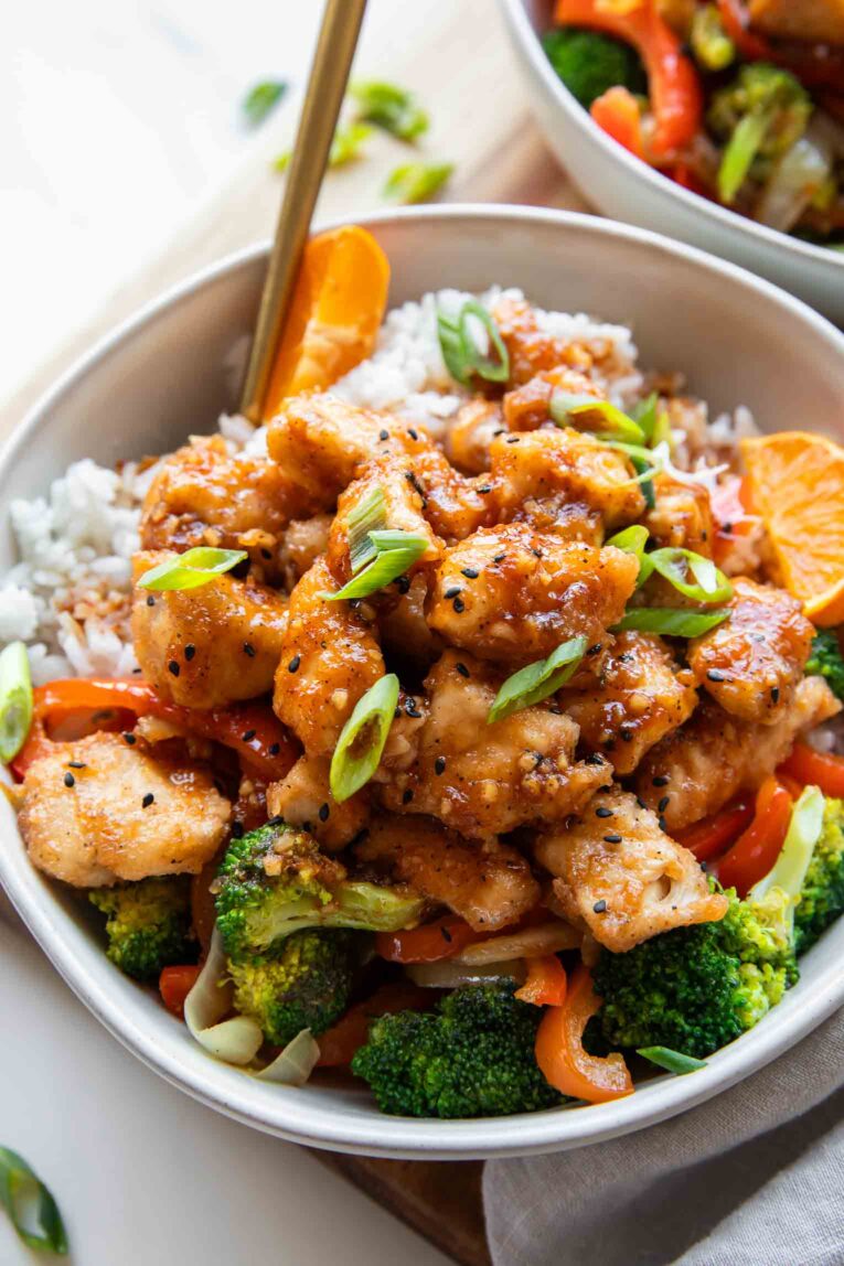 Angled photo of Orange Chicken Bowl with a fork.