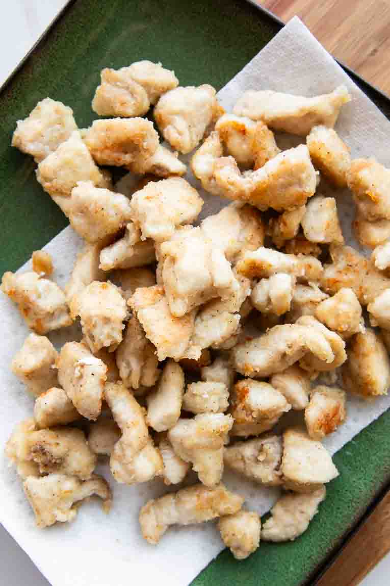 Crispy fried chicken bites on a plate.