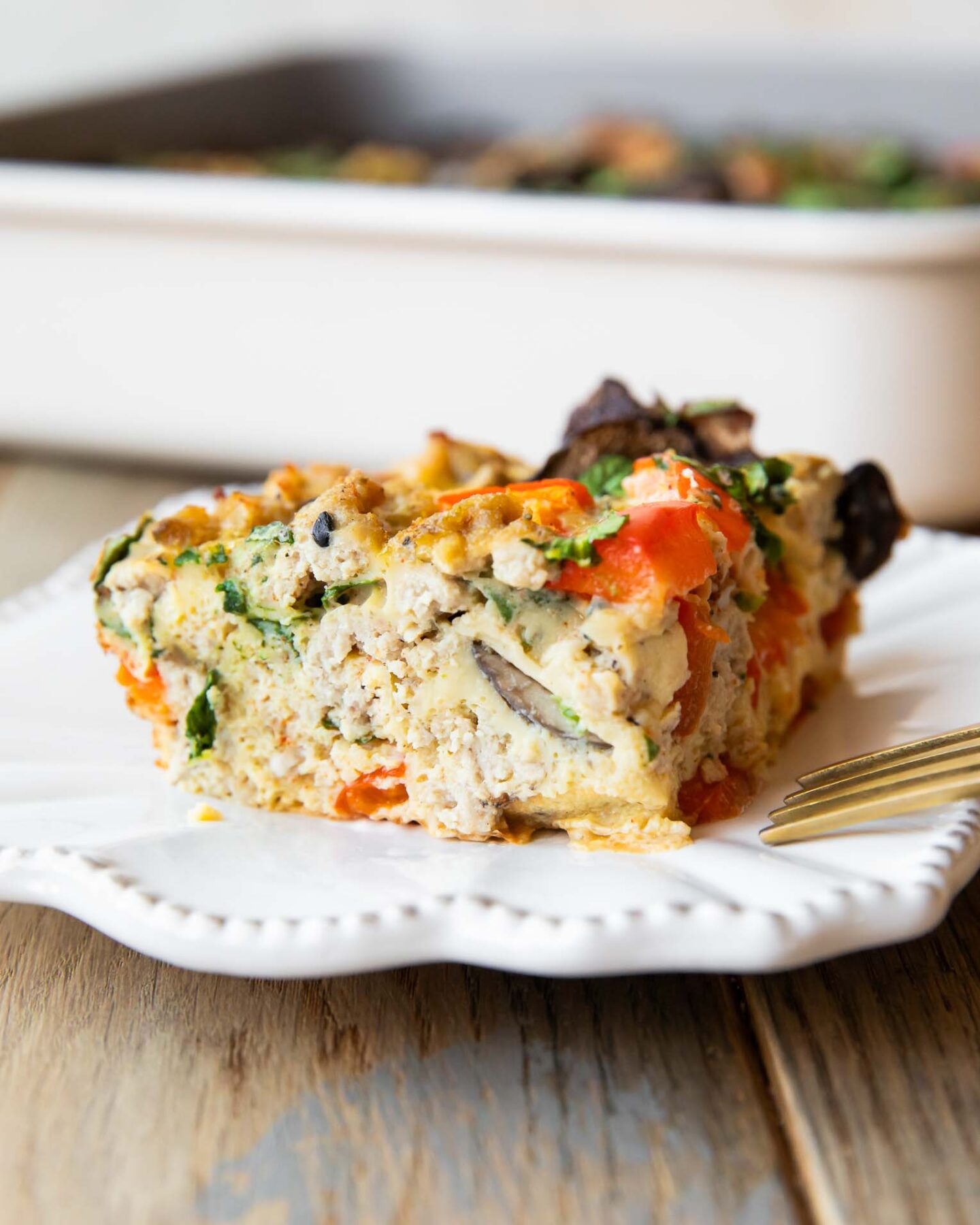 Close up of Whole30 Breakfast Casserole slice on a plate.