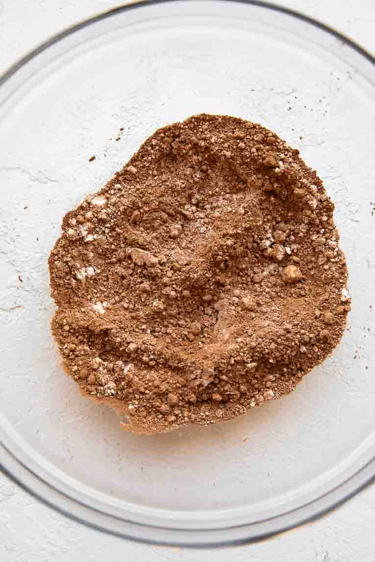 Dry ingredients for Cottage Cheese Brownies in a mixing bowl.