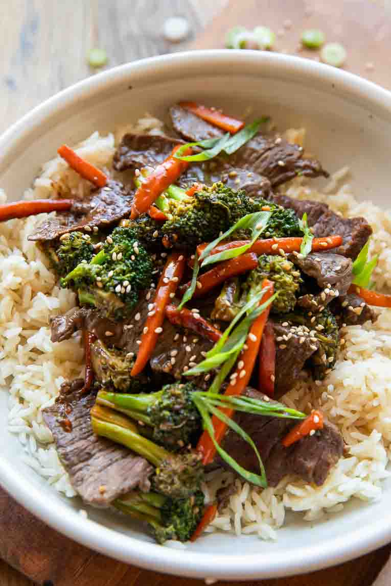 Angled photo of beef and broccoli stir fry in a bowl.