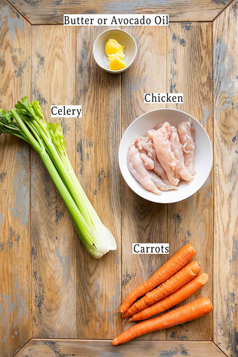 Chicken, veggies, and butter for Chicken Noodle Soup recipe.