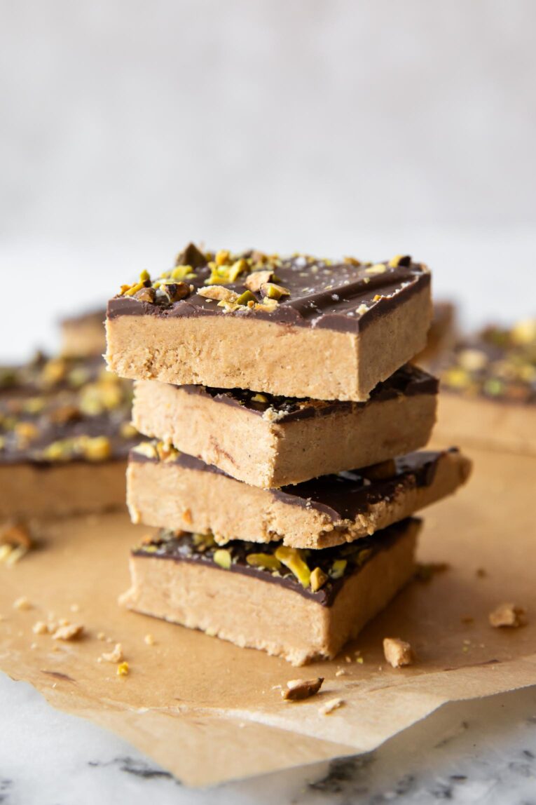 Angled photo of peanut butter protein bars with chocolate.